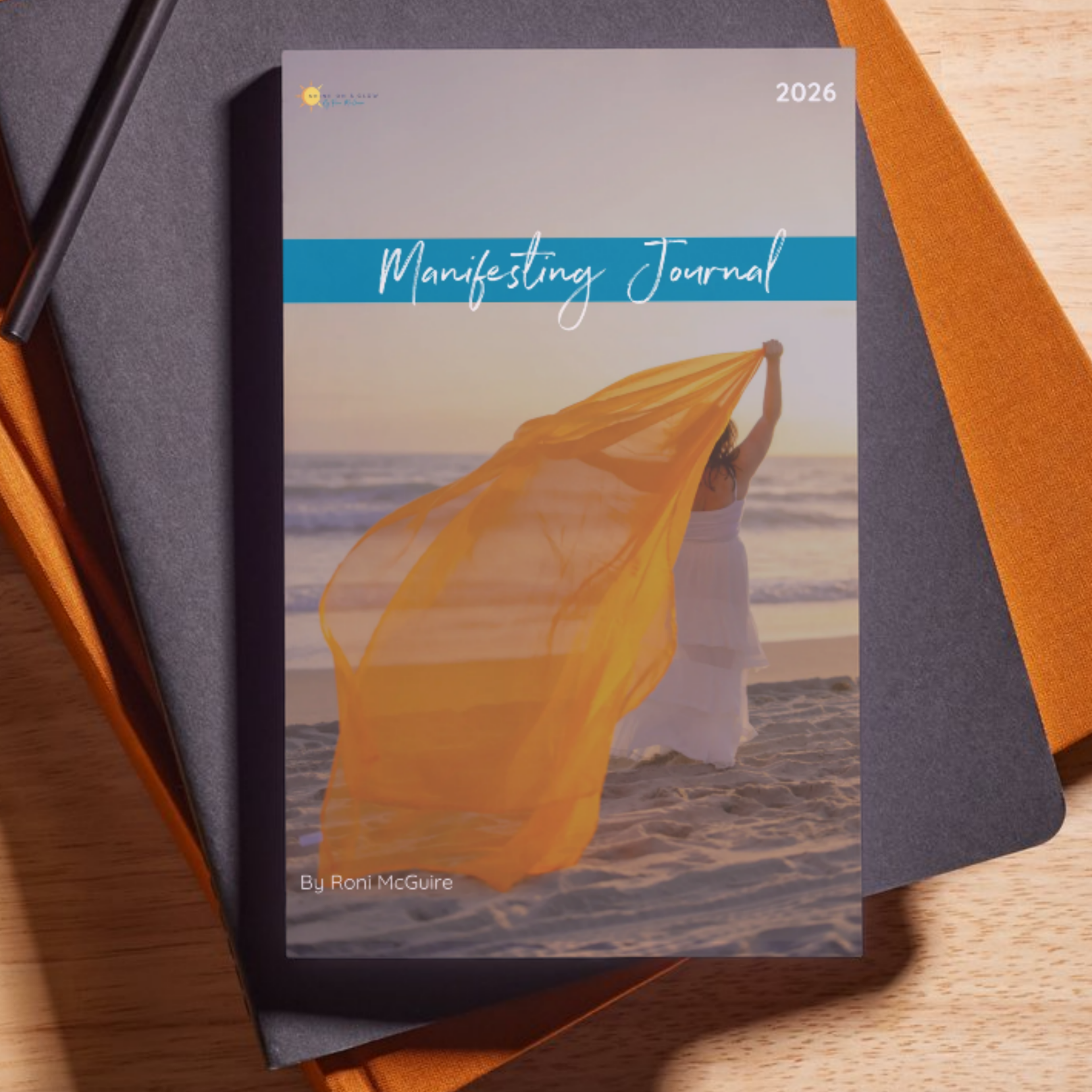 The Motifesting Journal on top of a stack of books